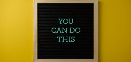 Inspirational message 'You Can Do This' displayed on a blackboard with a bold yellow backdrop.